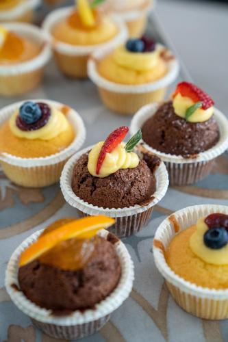 a bunch of cupcakes with fruit on top of them at Clipper in Pesaro