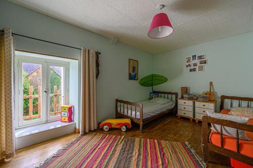 Posteľ alebo postele v izbe v ubytovaní Ty Fossac - Belle maison pour 6