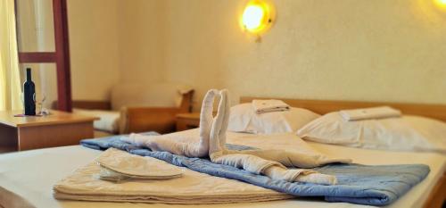 two beds with towels on top of them at FKK Ada Bojana in Ulcinj