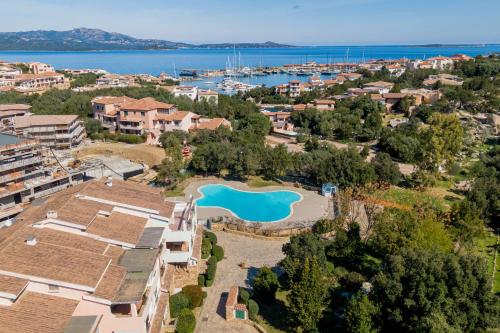 an aerial view of a resort with a blue pool at Sweet Mavy Incantevole Dimora by Wonderful Italy in Porto Rotondo