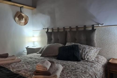 a bedroom with a bed with a headboard and pillows at La Casina in Capodimonte