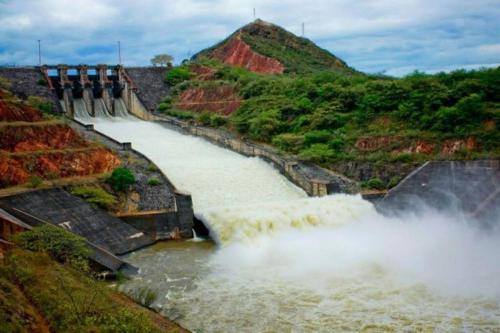 a dam with water shooting out of it in a river at Apartaestudio Sendero Primavera in Neiva