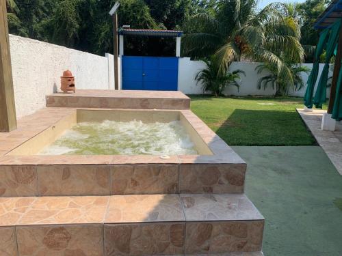 A piscina localizada em Chalet Casa Vacacional Riveras de Chulamar ou nos arredores