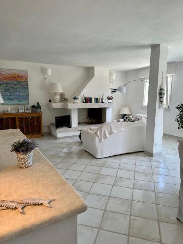 a living room with a white couch and a table at Chia Villas in Chia