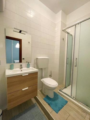 a bathroom with a toilet and a sink and a shower at Dimora Anna in Termoli
