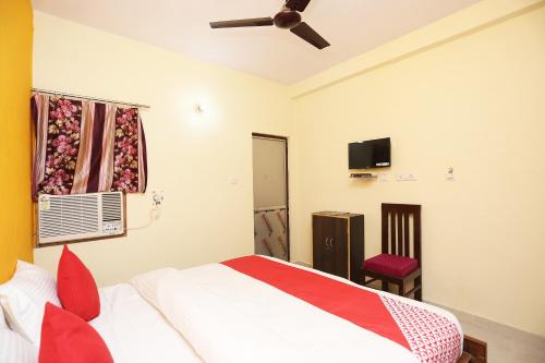 Cama o camas de una habitación en OYO Flagship Shree Shree Guest House