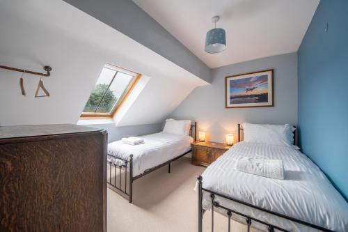 Ένα ή περισσότερα κρεβάτια σε δωμάτιο στο Sparrow Cottage