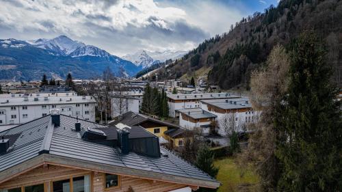 a view of a town with mountains in the background at Panorama Apartments - Steinbock Lodges in Zell am See