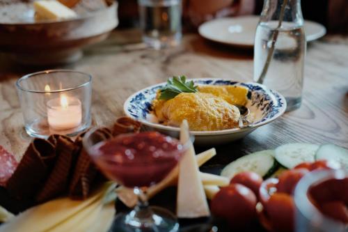 a table with a plate of food on a table at Hardanger Fjord Lodge in Bondhus