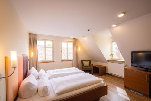Un pat sau paturi într-o cameră la Altstadthof Freinsheim