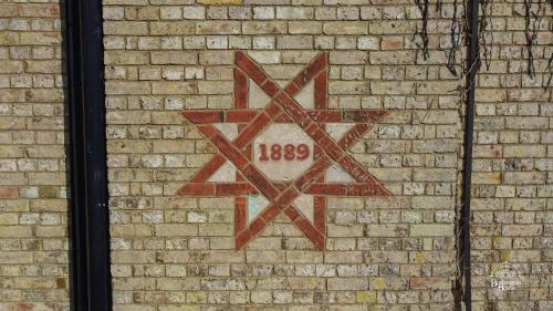 a star on the side of a brick wall at Burlington House Boutique in Oxford