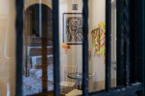 a reflection of a table in a window at Guest House Tomasi in Dubrovnik