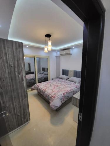 a bedroom with a large bed in a room at Royal Residence 3 New 2 bed apartment sea view with infinity pool in Sharm El Sheikh