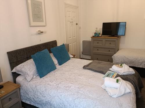 Ένα ή περισσότερα κρεβάτια σε δωμάτιο στο Tregella Guest House