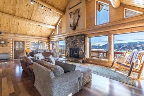 a living room with a couch and a fireplace at Bachelor Loop - 2310 in Creede