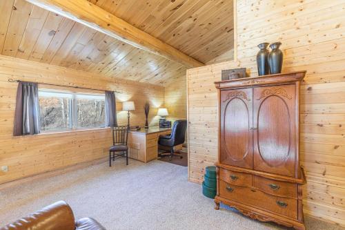 a room with a desk in a log cabin at Bachelor Loop - 2310 in Creede