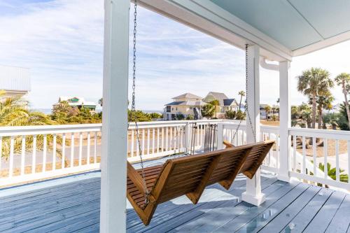 a porch swing with a view of the beach at Harbor Island 2 Ebb Tide Ct in Oceanmarsh Subdivision