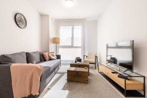 a living room with a couch and a table at INSIDEHOME Ciudad de Valladolid in Valladolid