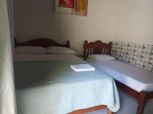 Tempat tidur dalam kamar di Engenheiros Hotel - Porto Velho