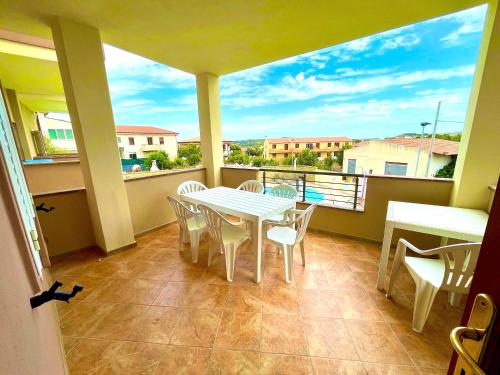 a white table and chairs on a balcony with a view at Apartment Valentina in Tergu