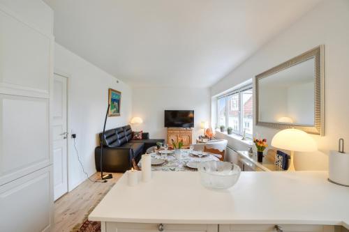 a kitchen and living room with a white counter top at Delicius apartment near the Beach,Metro, Airport in Copenhagen