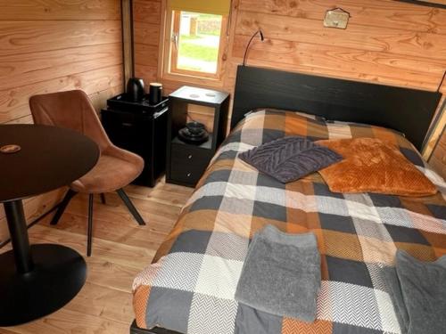 מיטה או מיטות בחדר ב-Hoogte Huisje Schotland