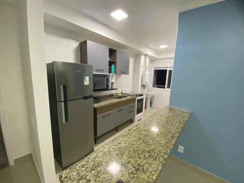 Kuchyň nebo kuchyňský kout v ubytování Guarujá condomínio villa di fiori AP 61 orquídea