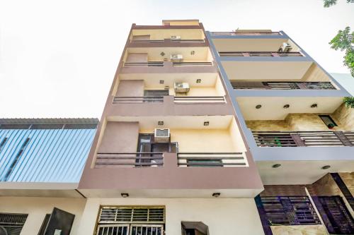 an external view of a building with balconies at OYO 74753 Sushma Ssadan in New Delhi