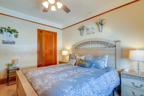 a bedroom with a bed with a blue comforter at Beautiful Historic Home Near Bryce Canyon! in Cannonville