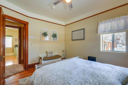 a bedroom with a bed and a desk and a window at Beautiful Historic Home Near Bryce Canyon! in Cannonville