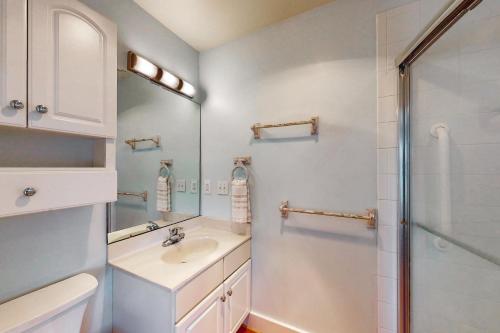 a bathroom with a sink and a shower at Carolina Haven in Topsail Beach