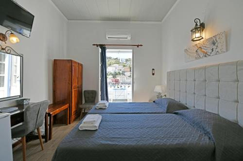 Postel nebo postele na pokoji v ubytování Delfini Hotel