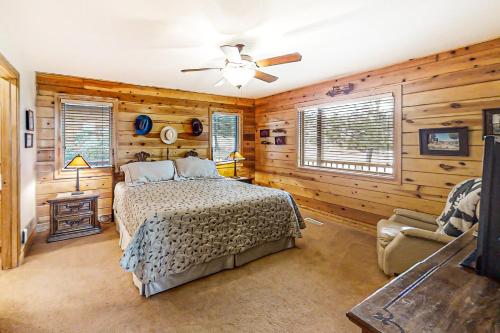 a bedroom with a bed and a ceiling fan at Joining Families at Bear Lake in Garden City