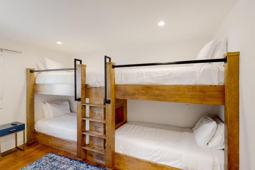 two bunk beds in a room with white walls at Leisure Lodge Living in Gunnison
