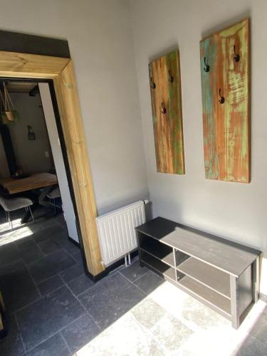 a room with a table in the corner of a room at huisje in zeeland helemaal gerenoveerd in Sint Annaland