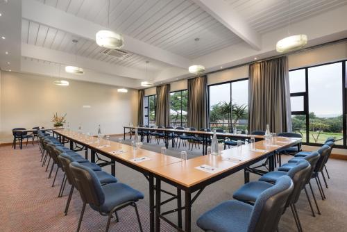 a large conference room with a long table and chairs at ANEW Resort Hunters Rest Rustenburg in Rustenburg