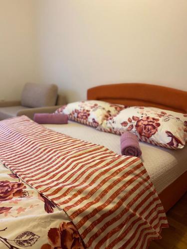 two beds with blankets and pillows in a room at Spirit 3 in Međugorje