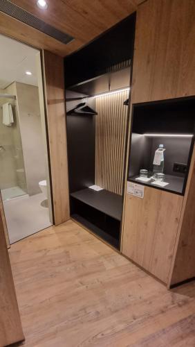 a bathroom with a shower and a toilet in a room at Hotel Principe Avila in Lisbon