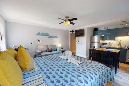 a bedroom with a large bed with a dog on it at 805 - Friendly Native Beach Resort in St. Pete Beach