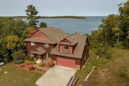 an overhead view of a house with a garage at Spacious Leech Lake Home on 2 Private Acres, 200' of lake shore 15 Minutes to Walker with boat lift, dock, swimming, fire pit in Walker