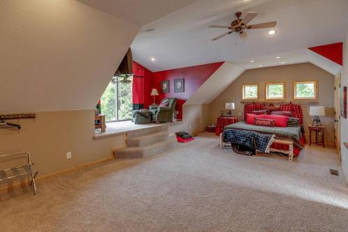 a bedroom with a bed and a ceiling fan at Luxury Leech Lake Home 15 Minutes to Walker in Walker