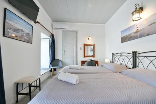 Ein Bett oder Betten in einem Zimmer der Unterkunft Delfini Hotel