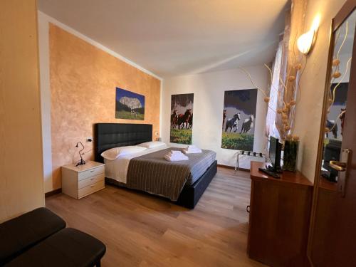 En eller flere senge i et værelse på Ancient Courtyard Bonanomi in Como Historic Centre