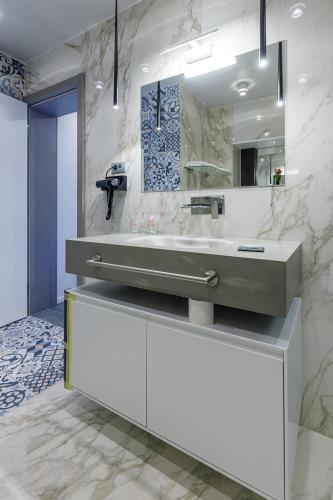 a bathroom with a sink and a mirror at Ferhadija 31 Old town Sarajevo in Sarajevo