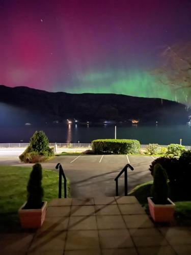a view of the aurora over the water at night at Glentower Lower Observatory in Fort William