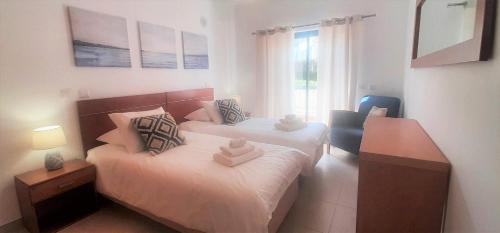 En eller flere senge i et værelse på Apartamento Buganvilia