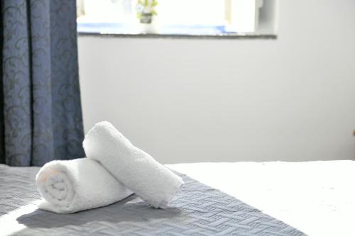 Ein Bett oder Betten in einem Zimmer der Unterkunft Delfini Hotel