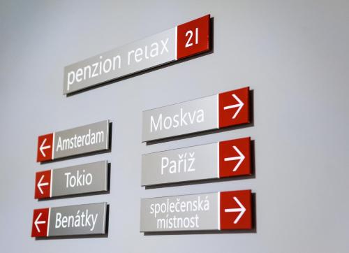 a group of signs with arrows pointing in different directions at Relax21 in Uherský Ostroh