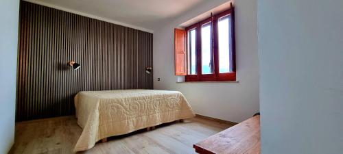 Posteľ alebo postele v izbe v ubytovaní Pollino House