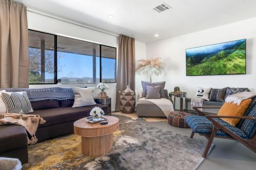 a living room with a couch and a table at The Castle House Estate in Joshua Tree